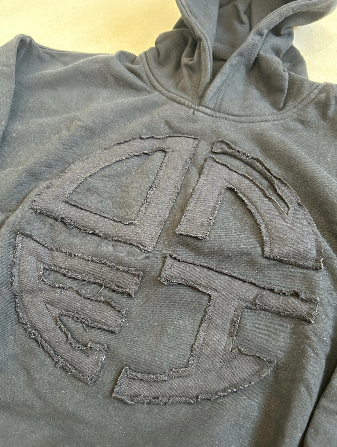 Black Pullover Hoodie – Embroidered Distressed Patch Logo (Clearance Sale)